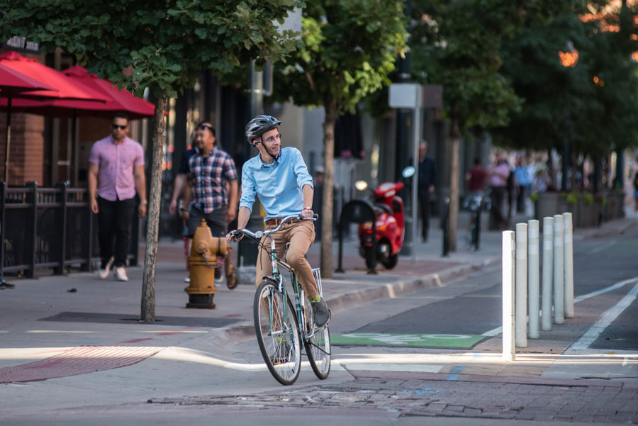 Matthew Downey riding a bike in Denver