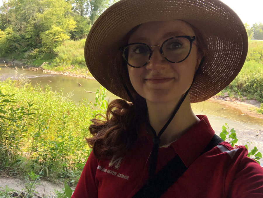 Rebekah DeFusco outdoors in a wide-brimmed hat