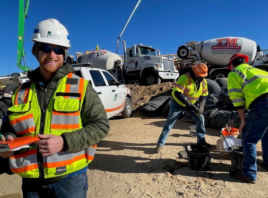 Sam Sorger in the field for construction wearing safety gear