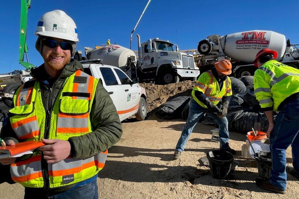 Sam Sorger in the field for construction wearing safety gear
